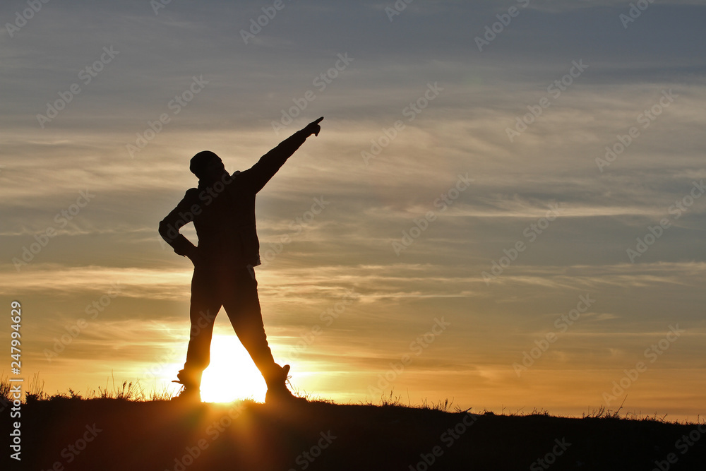 Fototapeta premium Man on sunset background