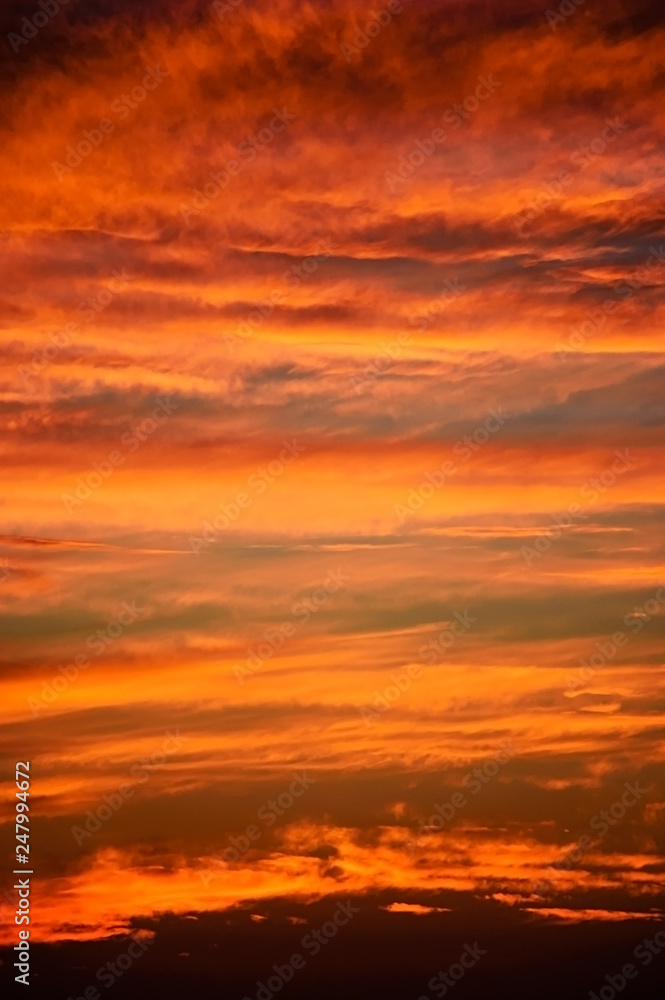 Burning sky and clouds at sunset
