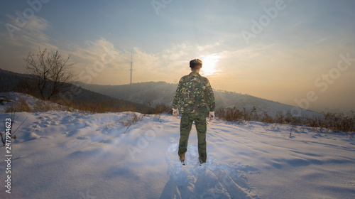 soldier on the mountain in winter
