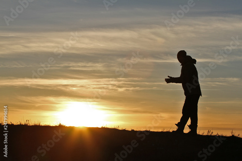 Fototapeta Naklejka Na Ścianę i Meble -  Man on sunset background