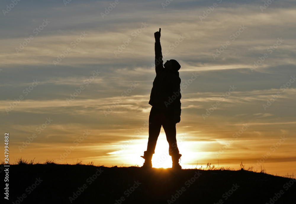 Fototapeta premium Man on sunset background