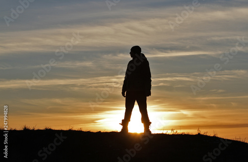 Man on sunset background