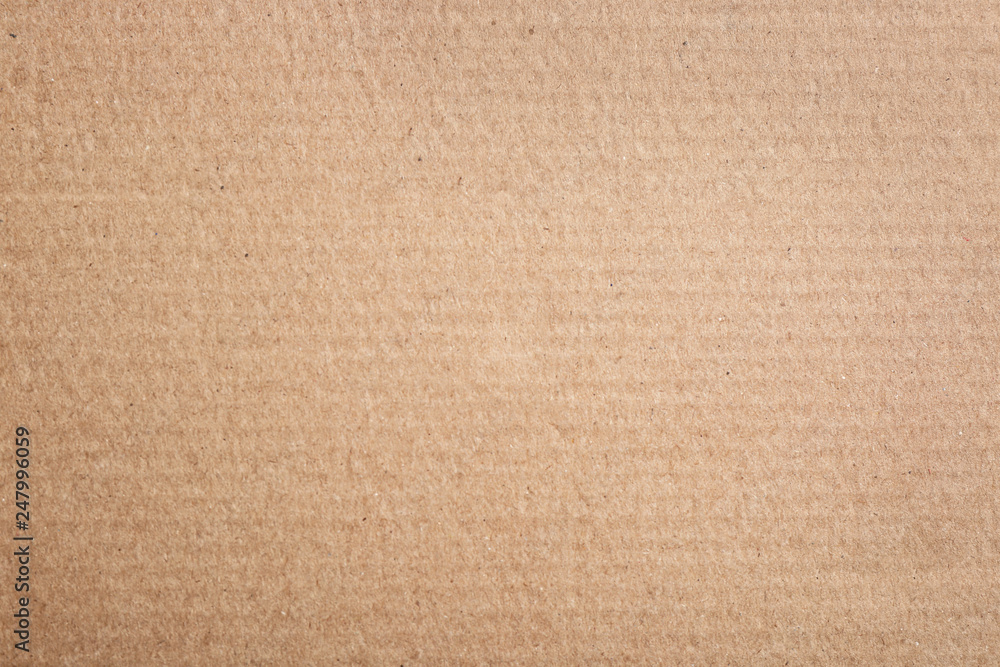 Fototapeta premium Sheet of cardboard as background, top view. Recycling concept