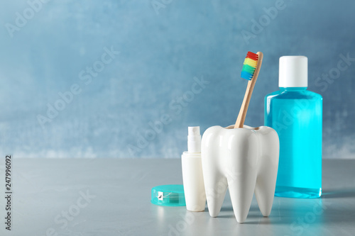 Composition with oral care items on table against color background, space for text. Healthy teeth