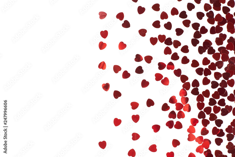 Red hearts confetti on white background. Valentine's day.