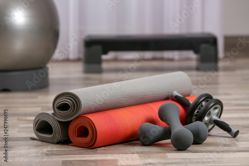 Set of fitness equipment on floor indoors