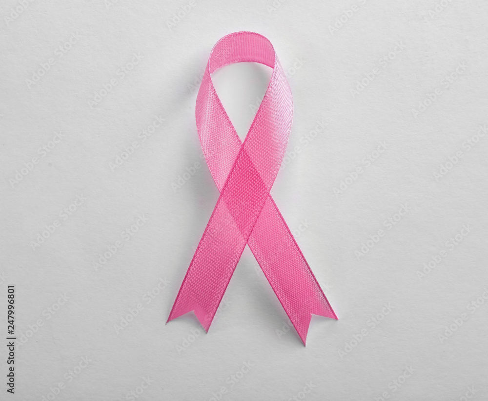 Pink ribbon on white background, top view. Breast cancer awareness concept Pink ribbon on white background, top view. Breast cancer awareness concept