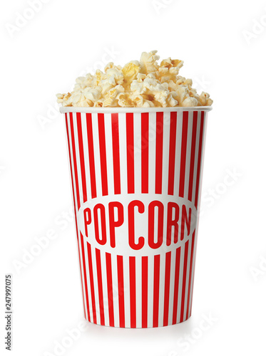 Cup with fresh tasty popcorn isolated on white. Cinema snack