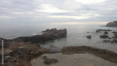 The coast in the sea of Santa Eulalia a cloudy day, Ibiza photo