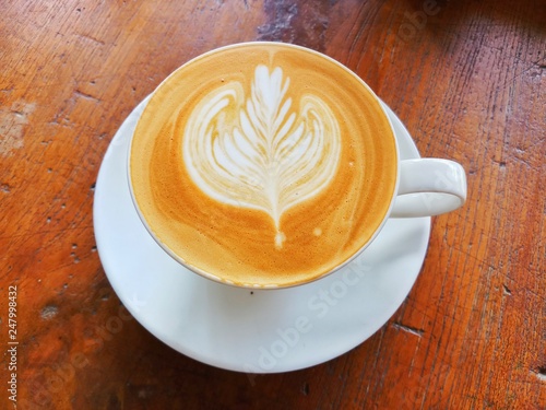 cup of coffee on wooden background