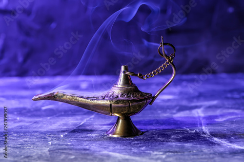 Aladdin lamp of wishes on table photo