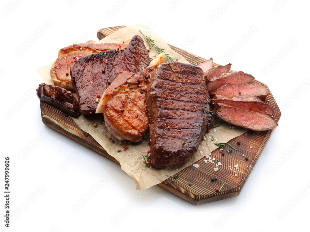 Wooden board with different tasty cooked meat on white background Wooden board with different tasty cooked meat on white background