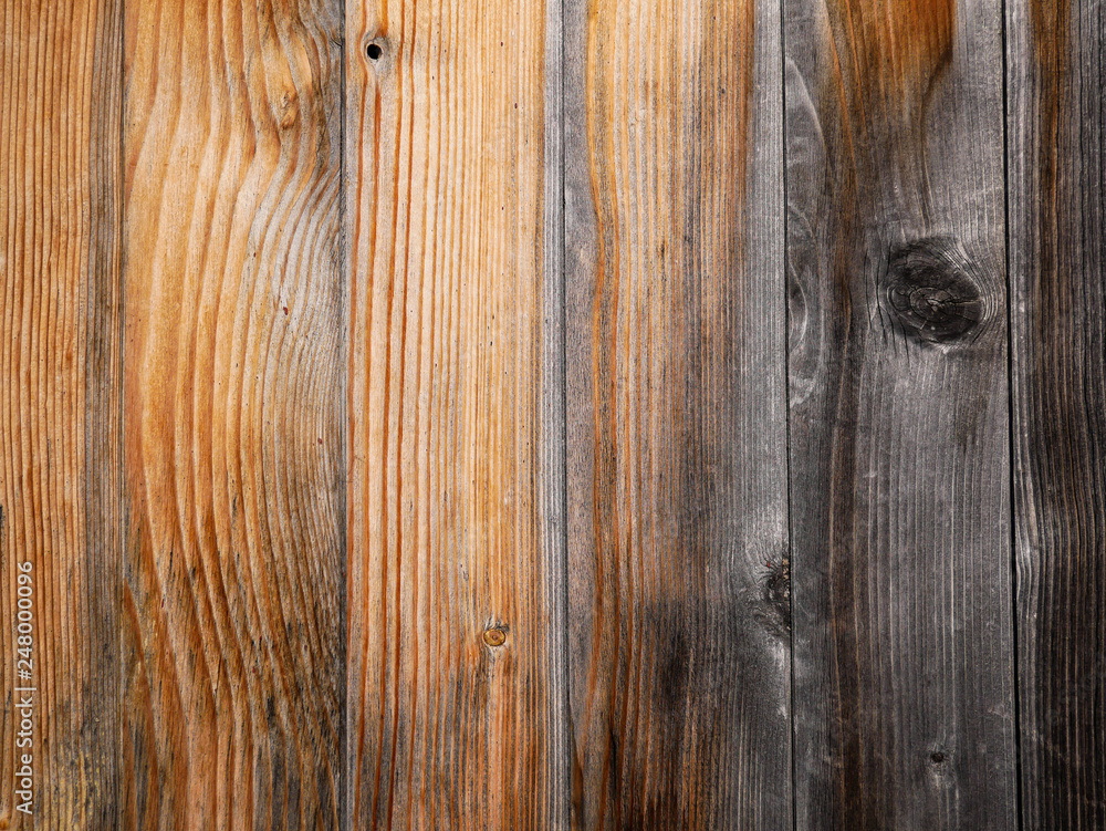 Naklejka premium Weathered pine boards close up shot on natural light, image for background.