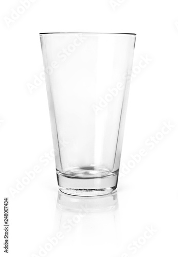 Empty drinking glass, isolated on white background. Glass cup or dish ware with copy space.