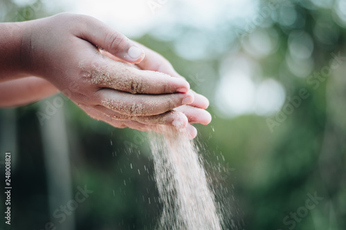 Sand blown out of the hand 