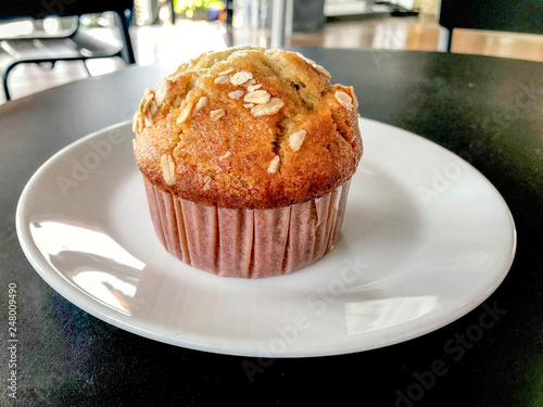 Banana muffin on a white plate