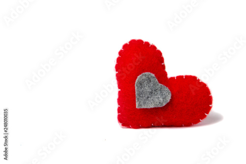 Felt red heart isolated on a white background