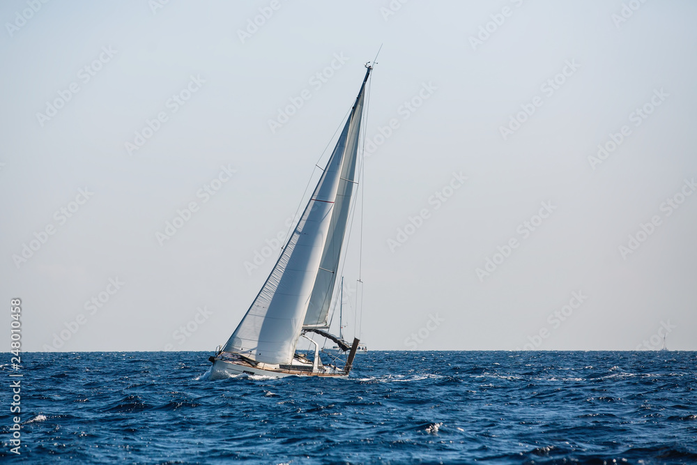 Sailing yacht boat glides on the Sea.
