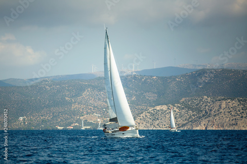Sailing boats participate in sail yacht regatta in the Aegean Sea. © De Visu