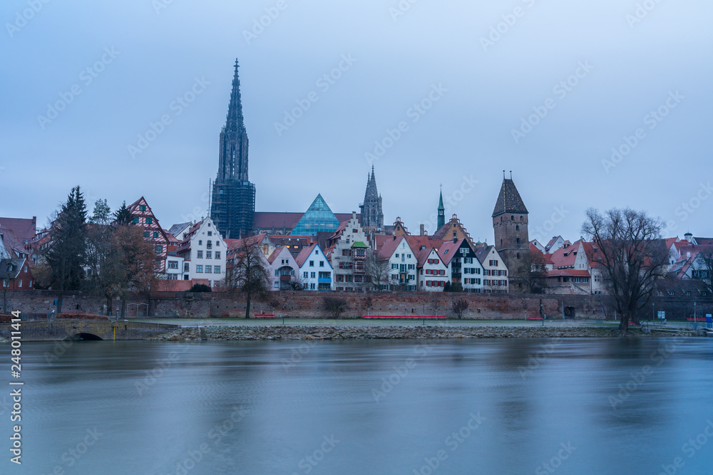 Germany, Famous minster of ulm behind houses of old town and water of danube river Germany, Famous minster of ulm behind houses of old town and water of danube river