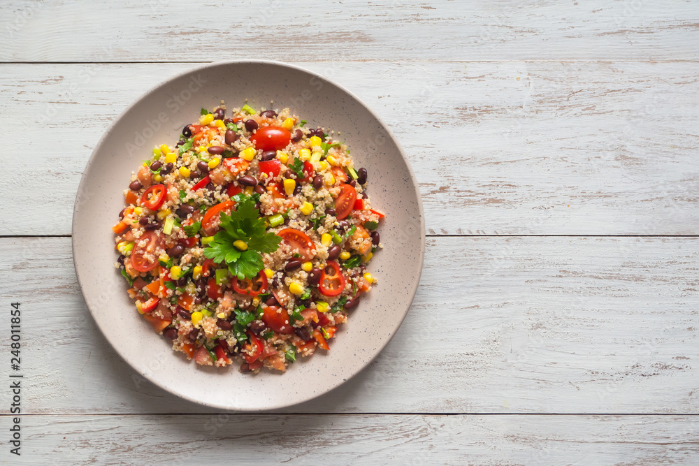 Mexican black bean corn quinoa salad on the table. Mexican black bean corn quinoa salad on the table.