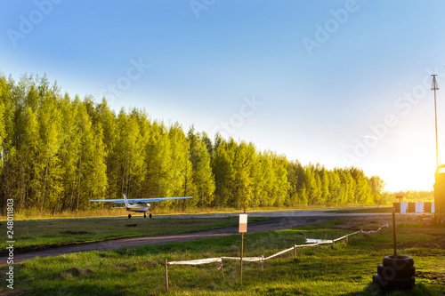 Light passenger planes parked before departure at private airport in Kronshtadt, St.Petersburg, Russia. Industrial and civil air transportation by aircraft. Professional flights on airplanes photo