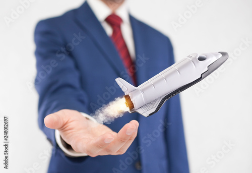 Wallpaper Mural Startup concept. Space shuttle takes off from the hand of the businessman Torontodigital.ca