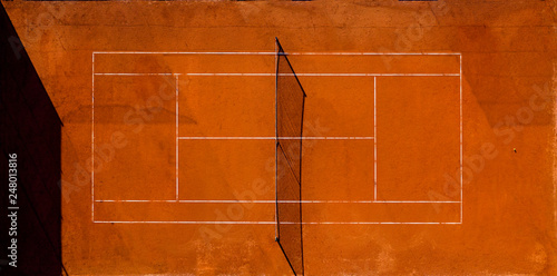 Aerial view of an empty tennis court at sunset © Travel Wild