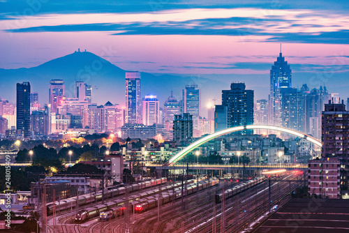 Cityscape and railway station at evening time. Shenzhen. China.
