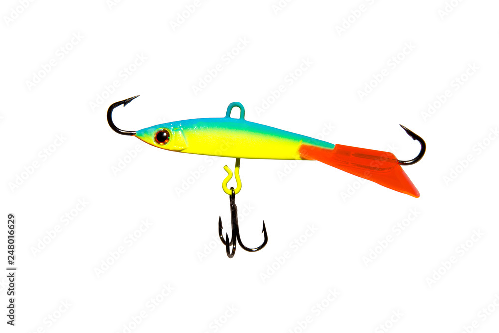 Winter bait balancer for predatory fish. Bright yellow with green balancer. With red fin. On white background. Isolated. Winter bait balancer for predatory fish. Bright yellow with green balancer. With red fin. On white background. Isolated.