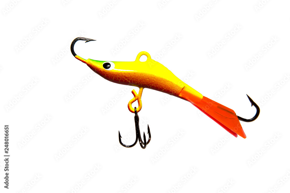 Winter bait balancer for predatory fish. Bright yellow. Red fin. On white background. Isolated. Winter bait balancer for predatory fish. Bright yellow. Red fin. On white background. Isolated.