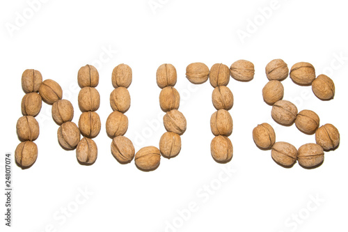 Close-up of walnut. A word made of walnuts. On white background. Isolated.