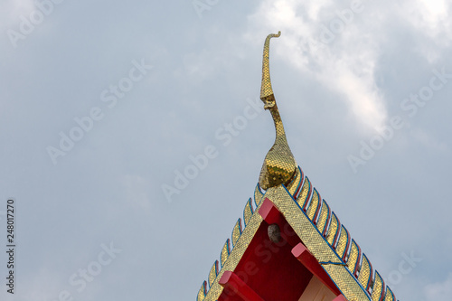 golden chofah of a wat in Bangkok, Thailand, Asia photo