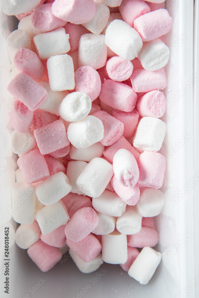 Top view on pink and white marshmallows in a white tray Top view on pink and white marshmallows in a white tray