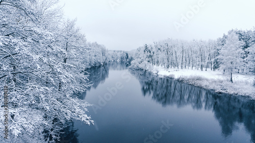 View of the snowy valley winter river. © Виталий Волосевич