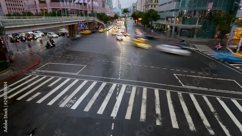 4K Time lapse traffic at the intersection in the evening photo