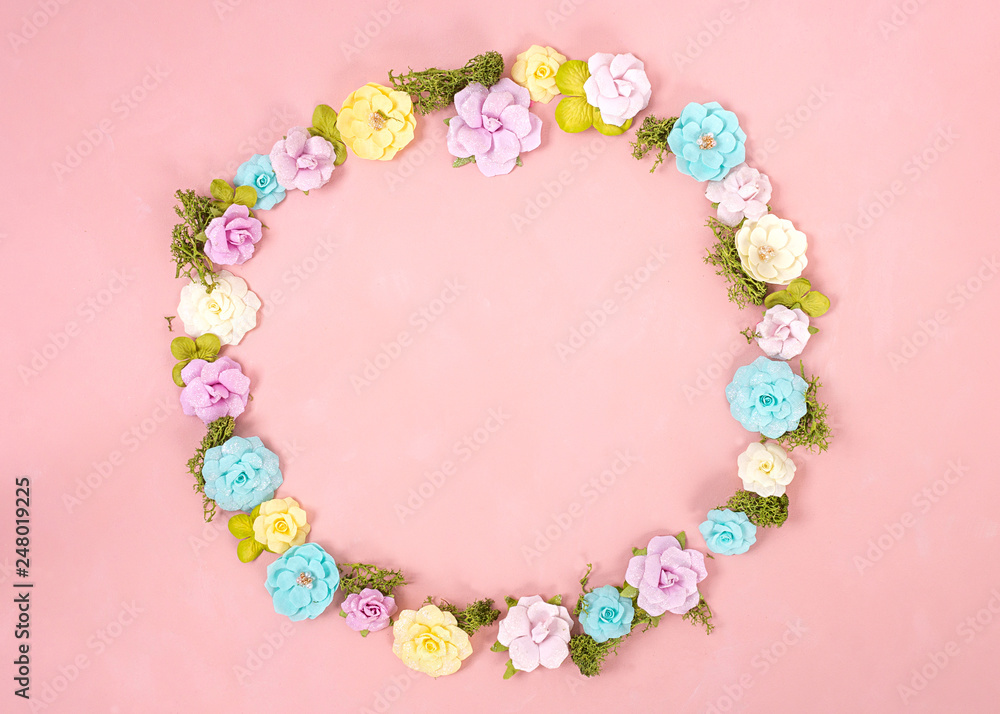 A wreath of multicolored paper flowers on the Living Coral background . Valentine day. love concept. Spring mood. Space for text. Wide banner - Image. A wreath of multicolored paper flowers on the Living Coral background . Valentine day. love concept. Spring mood. Space for text. Wide banner - Image.