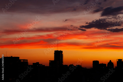 Silhouettes Sunset in the City. Orange Sky. City Background.