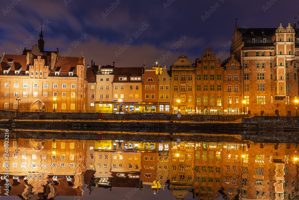 Beautiful Gdansk river view, medieval houses and gates of Poland