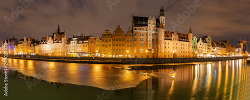 Gdansk evening panorama with medieval gates and Old Town facades on the bank of the Motlawa river