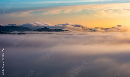 Bucovina sunrise in autumn morning with mist and low clouds , Romania  © Eduard