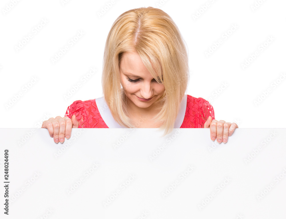 Portrait of happy smiling young woman, showing empty blank signboard with copyspace. Businesswoman holding big white banner, isolated on white background. Portrait of happy smiling young woman, showing empty blank signboard with copyspace. Businesswoman holding big white banner, isolated on white background.