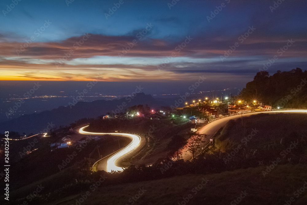 Light-Trails Shape Heart, view morning of headlight from many cars running on the road up to the hill at curve road shape heart, Phu Thap Boek, Phetchabun, Thailand.