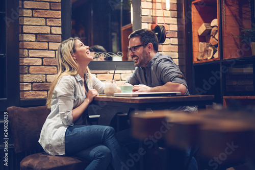 Beautiful couple on a romantic date in cafe - Image photo