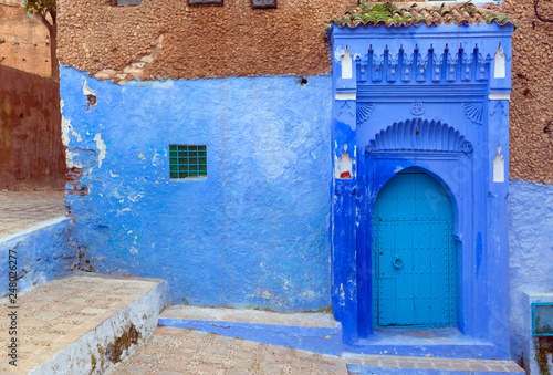 Blue door on street in Chefchaouen © Kokhanchikov