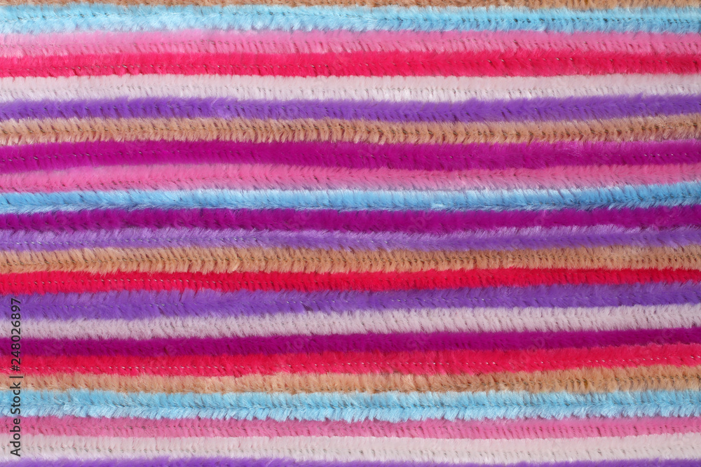 Background - colorful fluffy decorative wires, located close to each other