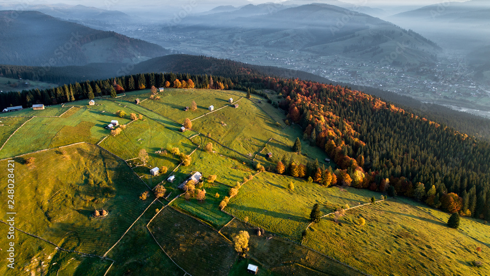 Romanian landscape in Transylvania aerial view from drone at sunrise 