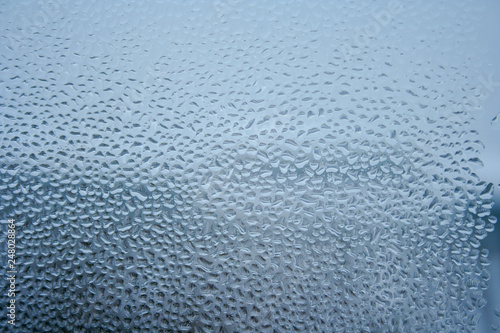 Background with water drops on the glass. Water vapor on the window