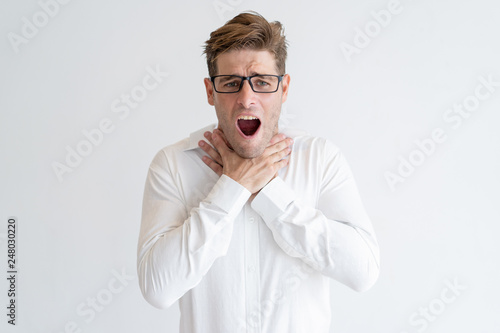 Frustrated man showing suffocation gesture