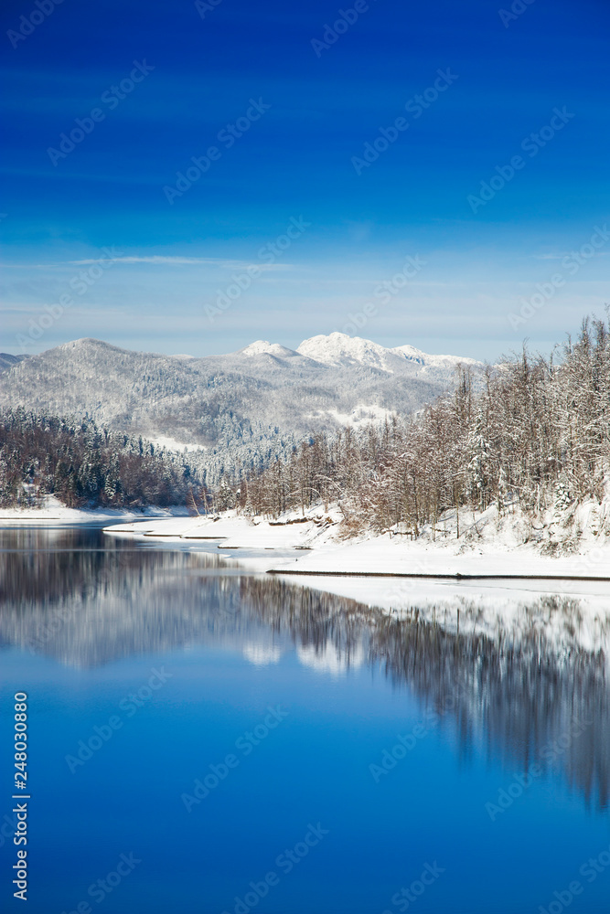     Beautiful peaceful lake in mountains in winter, nature landscape in Gorski kotar, Croatia 